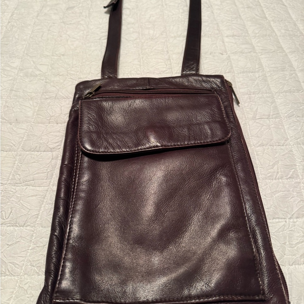 Genuine Leather. Very unique Brown Leather crossbody. So many compartments.
